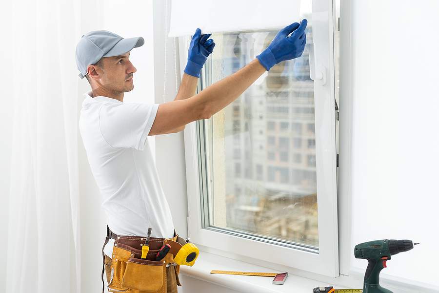 bigstock A Repairman Repairs Adjusts O 461803535