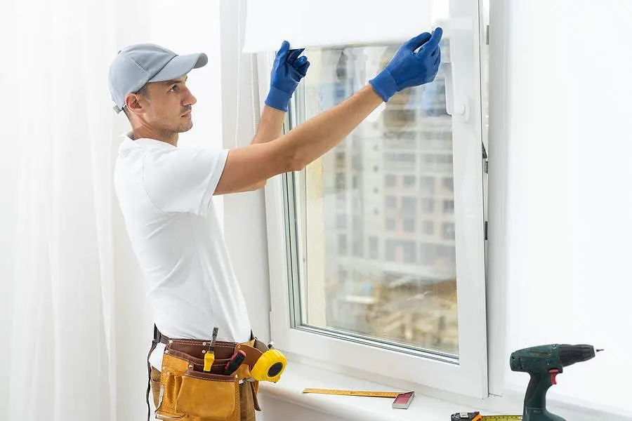 bigstock A Repairman Repairs Adjusts O 461803535