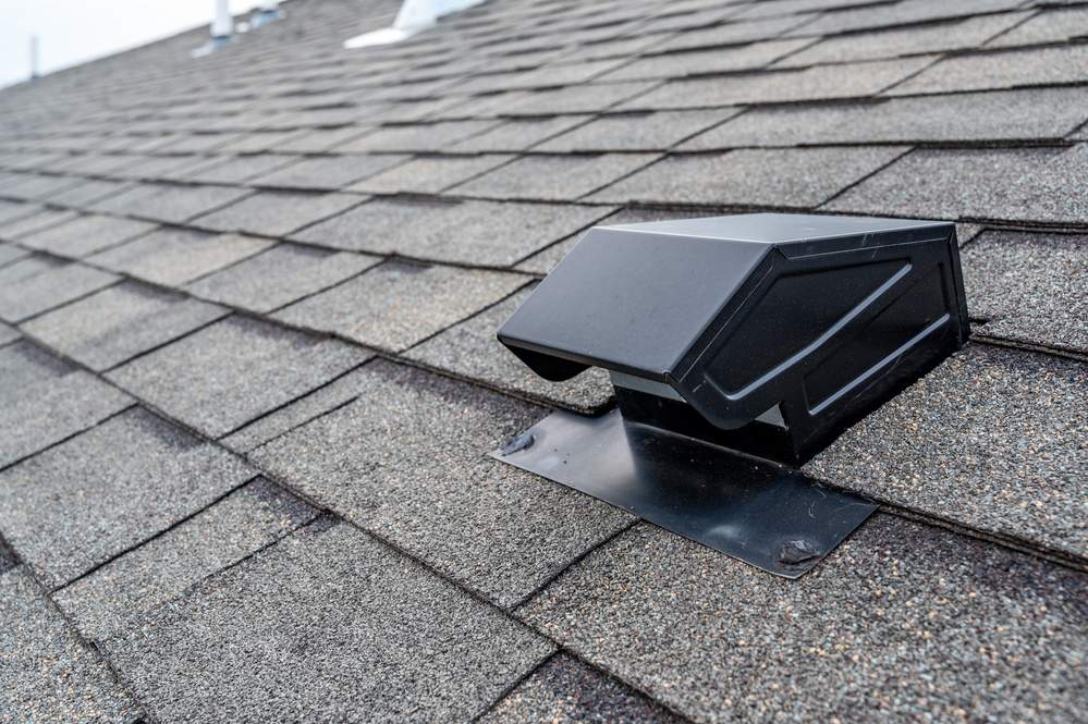 static vent installed on a shingle roof for passive attic ventilation