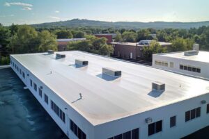 seamless white pvc commercial flat roof of factory summer day aerial high-view