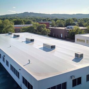 seamless white pvc commercial flat roof of factory summer day aerial high-view