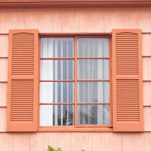 vintage marvin window with orange tone wall
